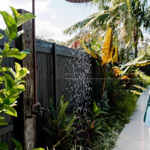 Copper outdoor shower for backyard landscaping ideas