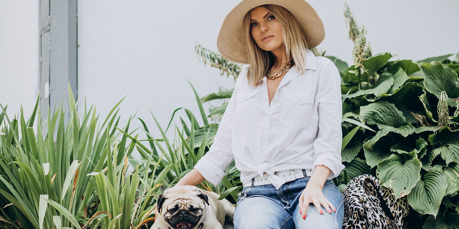 dog-friendly-gardens Woman sitting in her dog friendly gardens