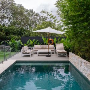sun lounge area around small plunge pool